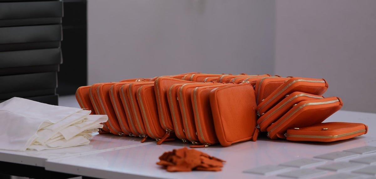 The Power of Orange: Why Are Orange Bags and Wallets So Popular?